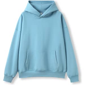 A light blue oversize hoodie with a front pocket and a hood. It features a simple design and has a logo.