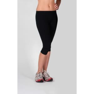 Black women's cotton spandex 3/4 leggings paired with athletic shoes on a neutral background.