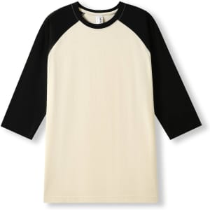 A men's/unisex 3/4 sleeve raglan T-shirt in cream with black raglan sleeves. The shirt has a logo.