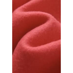 A close-up of soft, coral fabric with a textured, wavy appearance. Ideal for jumpers or hoodies.