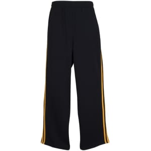 Black track pants featuring yellow side stripes and an elasticised waistband. The pants have a logo on them.