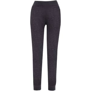 Dark grey brushed fleece track pants with a fitted design and pockets. Features a subtle logo.