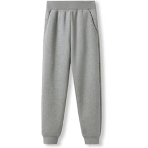 A pair of women's track pants in light grey, featuring an elastic waistband and side pockets.