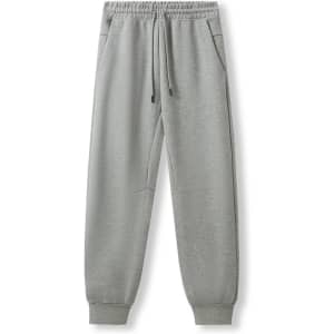 Men's three-layer cotton track pants in grey with an elastic waistband and pockets, featuring a logo.