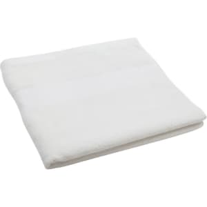 A folded white bath towel featuring a subtle texture and a small logo.
