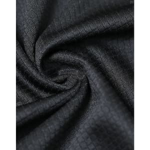 A close-up of black jacquard knit fabric, featuring a textured pattern and a subtle sheen, ideal for polo shirts.