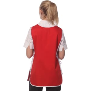 A ladies' smock in red with a back view, featuring a white collar and tied sides. It has a logo on the fabric.