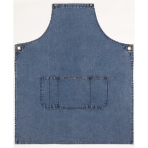 Denim bib apron in blue with a front pocket and metal snaps, featuring a logo.