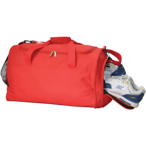 A red duffle bag with a zippered opening, featuring a side pocket containing a pair of shoes. It has a logo.