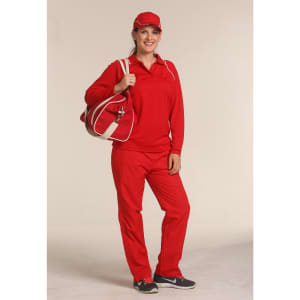 A woman in a red tracksuit and cap stands next to a red and white cotton canvas sports bag with a logo.