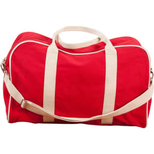 A red cotton canvas sports bag with cream straps and a detachable shoulder strap. It features a logo.