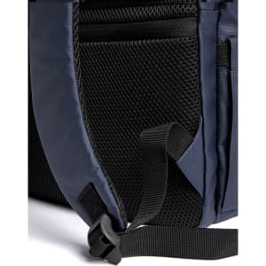 A navy blue backpack with mesh pockets and adjustable straps. It features a sleek design and exterior compartments.