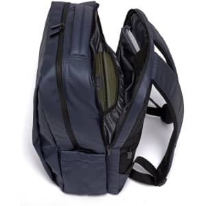 A navy blue PU backpack featuring multiple compartments and a padded back for comfort. Includes a logo.