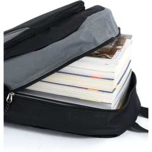 A black and grey backpack partially open, revealing several stacked books inside. It features a logo on the exterior.