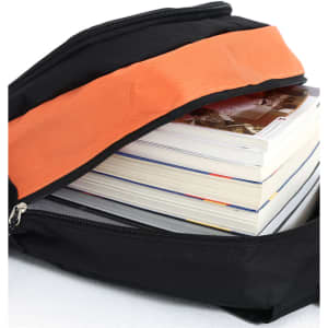 A black backpack with an orange accent unzipped to reveal stacked magazines inside.