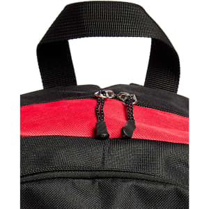 A black and red backpack with a dual zip closure and a top handle. It features a textured fabric and has a logo.