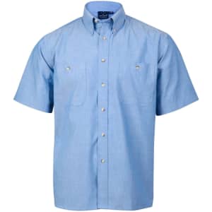 A short-sleeve button-up shirt in light blue chambray with two front pockets and a collar, featuring a logo.