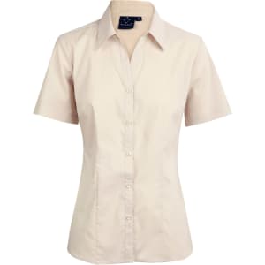 A short sleeve button-up shirt in a light beige colour, featuring a collar and a logo on the tag.