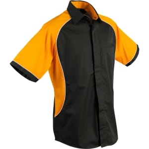 A black and orange button-up shirt featuring contrast seams and a single chest pocket. It has a logo on the chest.