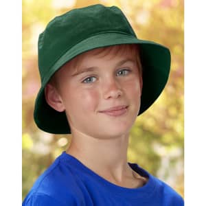 A green soft washed bucket hat worn by a child with a blue shirt, featuring a subtle logo. Background is blurred.