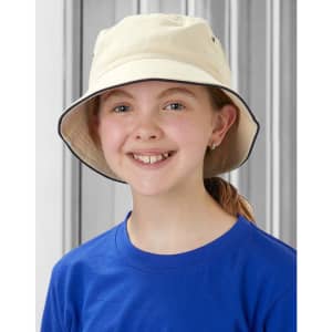 A child wearing a soft washed cream bucket hat with a contrasting trim, set against a grey background.