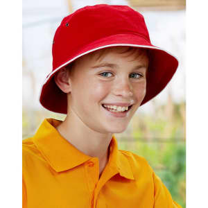 A red bucket hat featuring contrast trim, worn by a smiling young boy in an orange shirt, with a logo present.