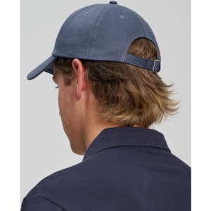 A cotton twill unstructured cap in navy blue, featuring a adjustable strap and a branding detail at the back.