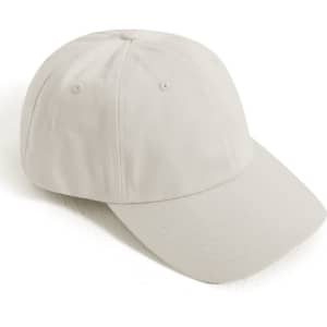 A cotton twill unstructured cap in a light beige colour, featuring a curved brim and a logo.