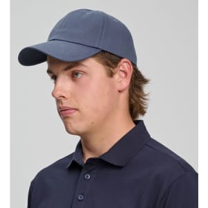 A cotton twill unstructured cap in navy blue, featuring a curved brim and an adjustable strap at the back.