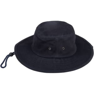 A navy blue bucket hat featuring ventilation eyelets and a drawstring. It has a logo on the side.