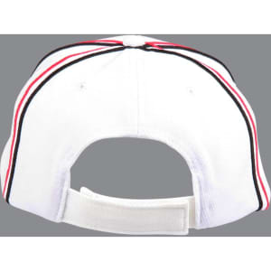 A structured cap in white with red and black accents and a rear adjustable strap. Features a branding logo.