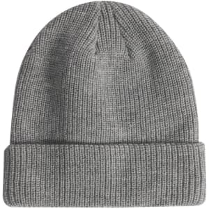 A grey cable knit snug beanie with a roll-up cuff and a small logo on the side.