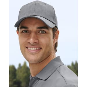 A grey cap features a structured design and a logo, worn by a smiling man in a casual setting.