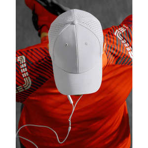 A white cap with laser cut detailing, positioned on a red shirt, featuring a logo.