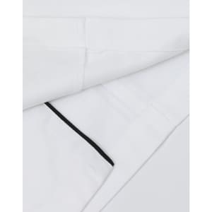 A unisex executive chef jacket in white with black detailing and a logo on the fabric.