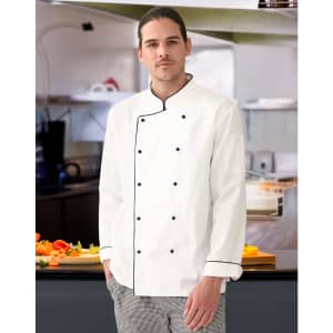 A unisex executive chef jacket in white with black trim, worn by a model in a kitchen setting.