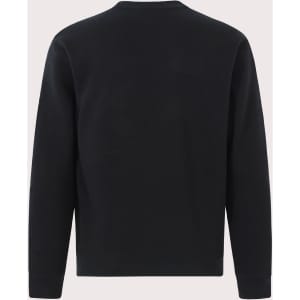 A black kids' crew neck fleecy sweater with long sleeves and a simple design. It features a logo on the garment.