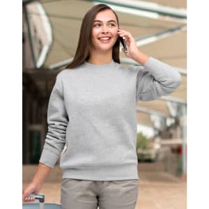 A grey crew fleece jumper with long sleeves, modelled by a person talking on a phone.