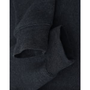 A dark grey crewneck sweatshirt featuring a soft fleece texture and rolled cuffs. It has a logo near the neckline.