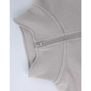 A grey 1/2 zip collar fleecy jumper with a smooth texture and a concealed zipper. Features a branding logo.