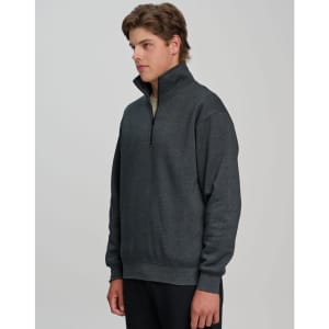A grey 1/2 zip collar fleecy jumper featuring a logo, designed for warmth and comfort.