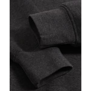 A close-up of the cuffs of a dark grey polar fleece jumper featuring a logo.