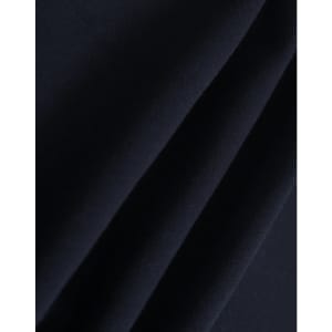 A close-up of dark navy polar fleece fabric showing soft, smooth texture folds. It features a branding logo.