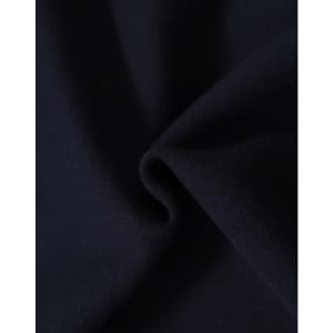 A close-up of dark navy fabric, showcasing the soft texture of a fleecy hoodie material.