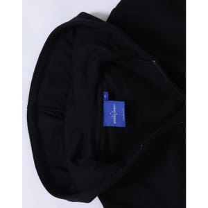A black full-zip fleecy hoodie with a hood and a label inside.