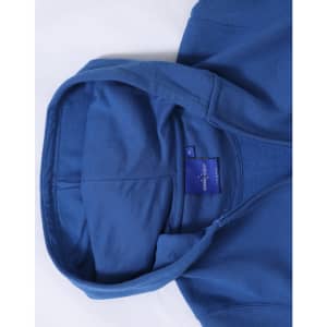 A blue full-zip fleecy hoodie with a spacious hood and a label inside.