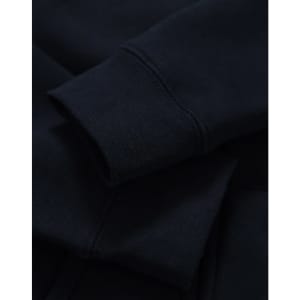 A close-up of a navy full-zip fleecy hoodie showcasing the cuffs and fabric texture. It has a logo.