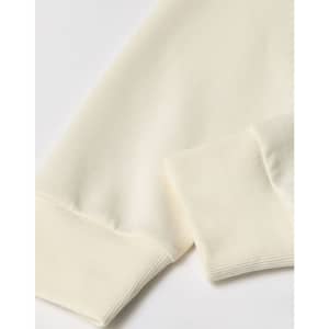 A crew neck sweater in a creamy off-white colour, featuring ribbed cuffs and a smooth fabric texture.