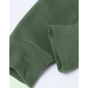 A close-up of an adult's hoodie in dark green, featuring a fleecy texture and a contrasting design.