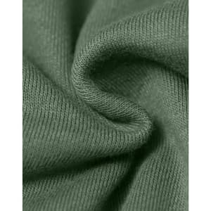 A close-up of textured fabric in a muted green colour, highlighting its soft and snug qualities.